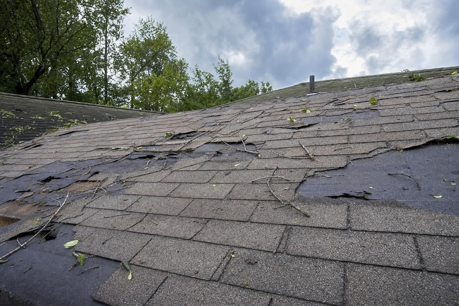 Storm damage roof repair cost: repair, replace, and the claim.
