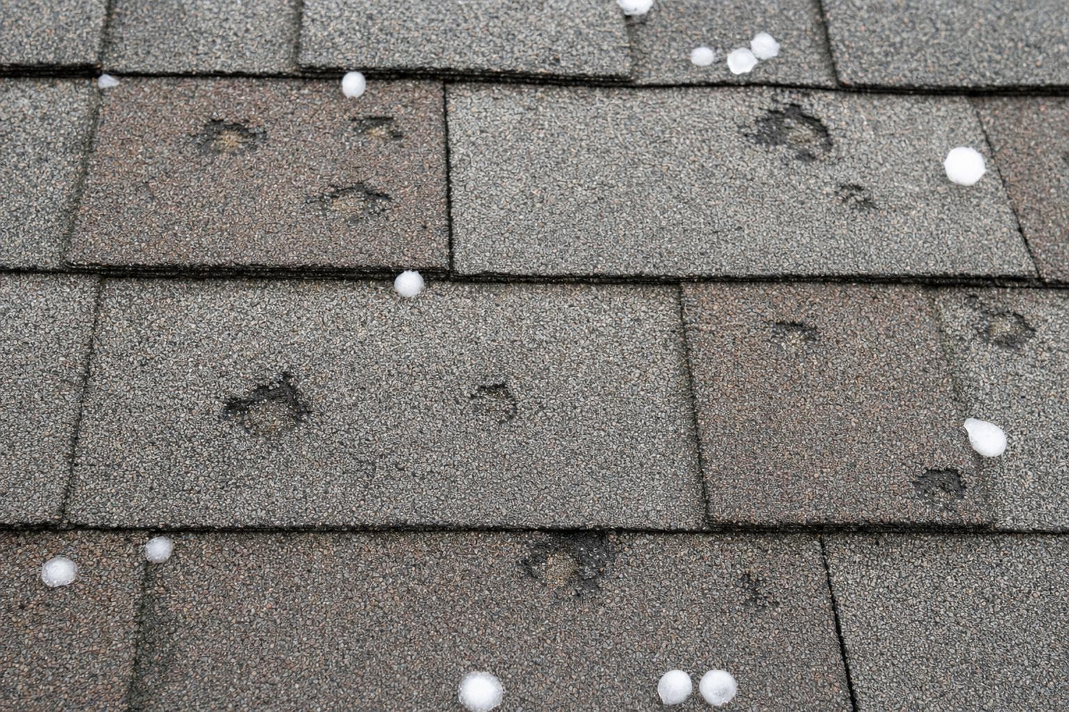 Documented functional impact damage distributed across roof areas